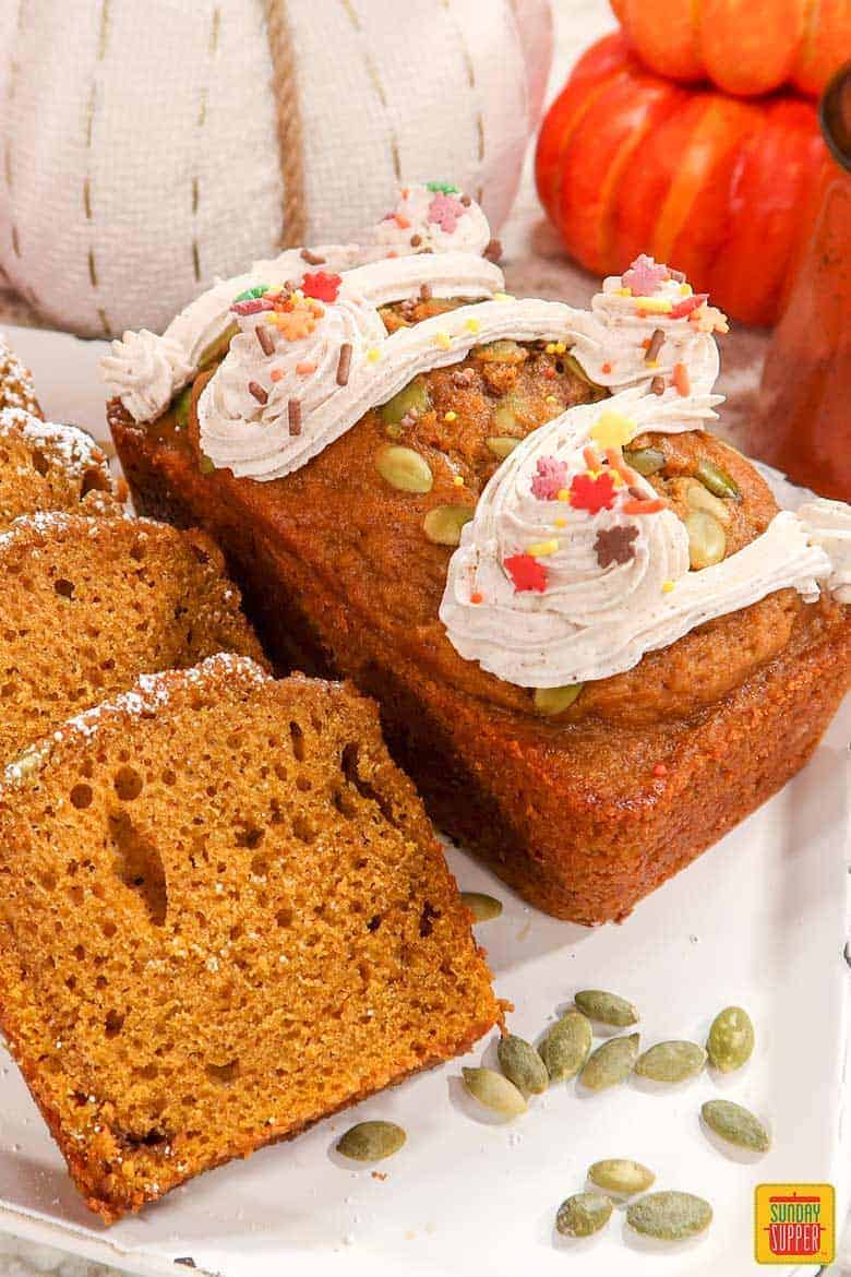 Starbucks pumpkin bread mini loaf with slices on white platter