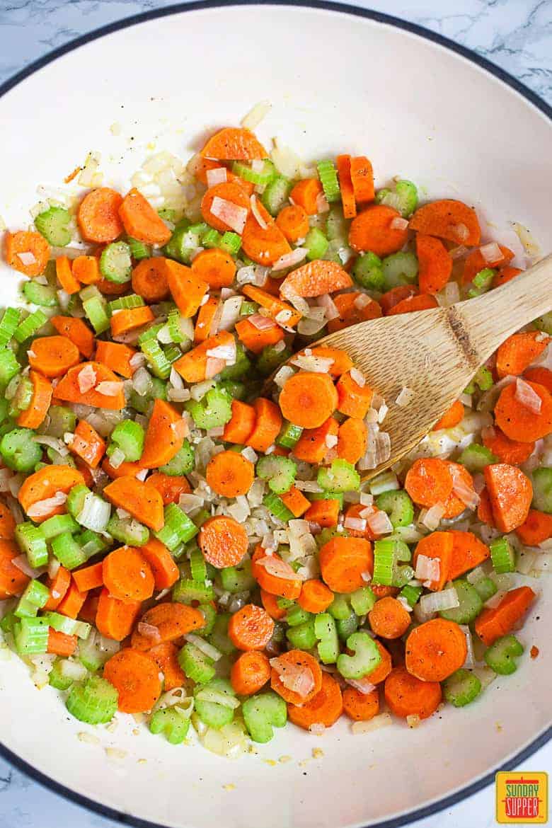 Garlic, Onions, Celery, and Carrots Sauteed In Large Skillet