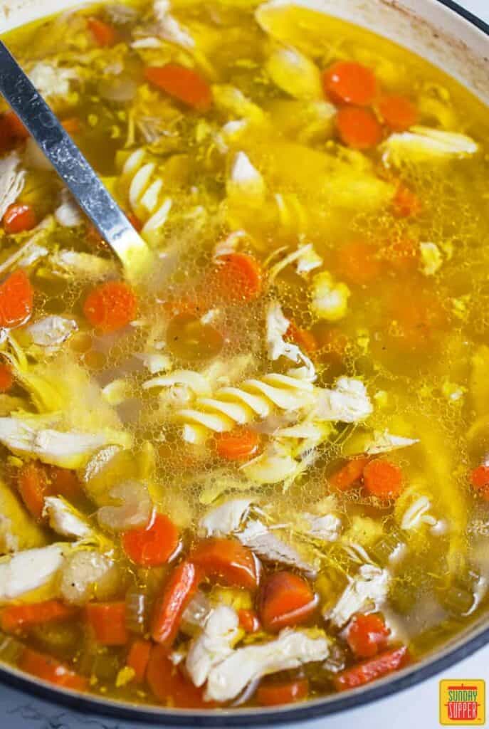 Chicken Noodle Soup Simmering In Soup Pan