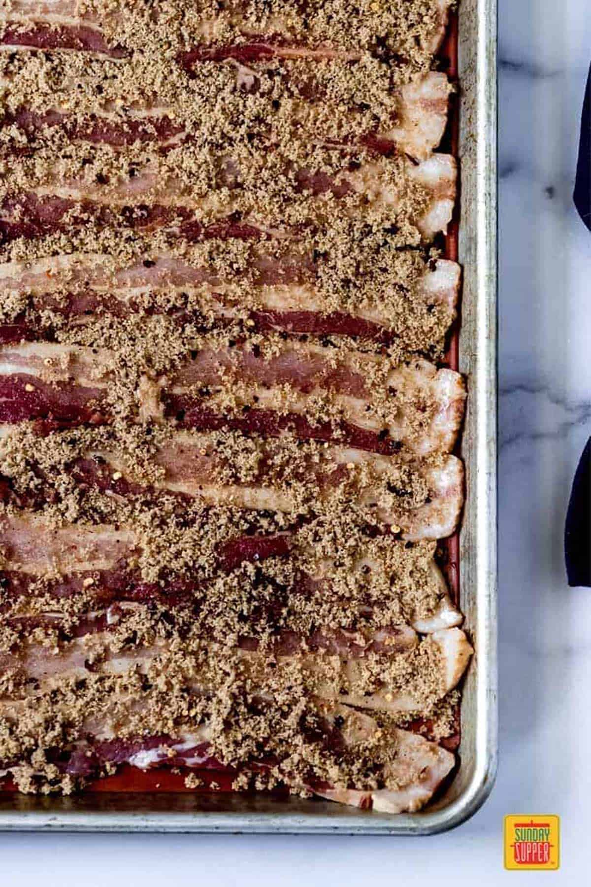 fully coat the candied bacon with the ingredients