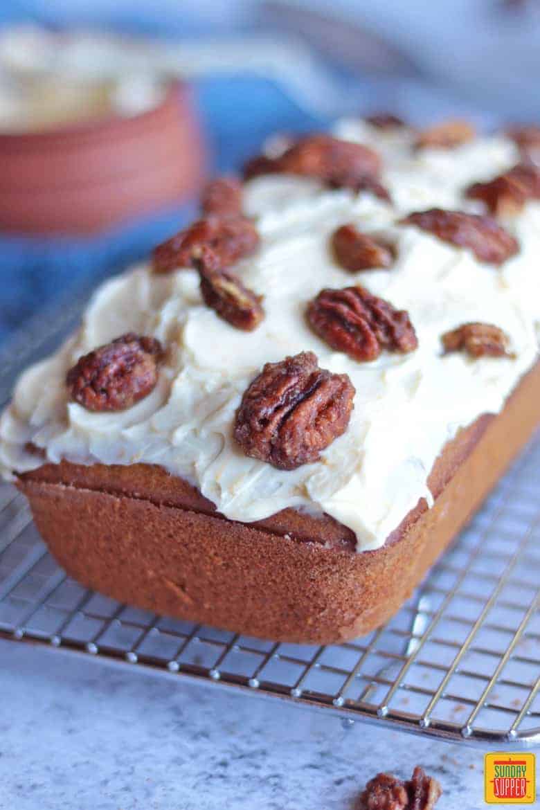 Caramelised Pecans over the Cream Cheese Frosting on a gingerbread loaf