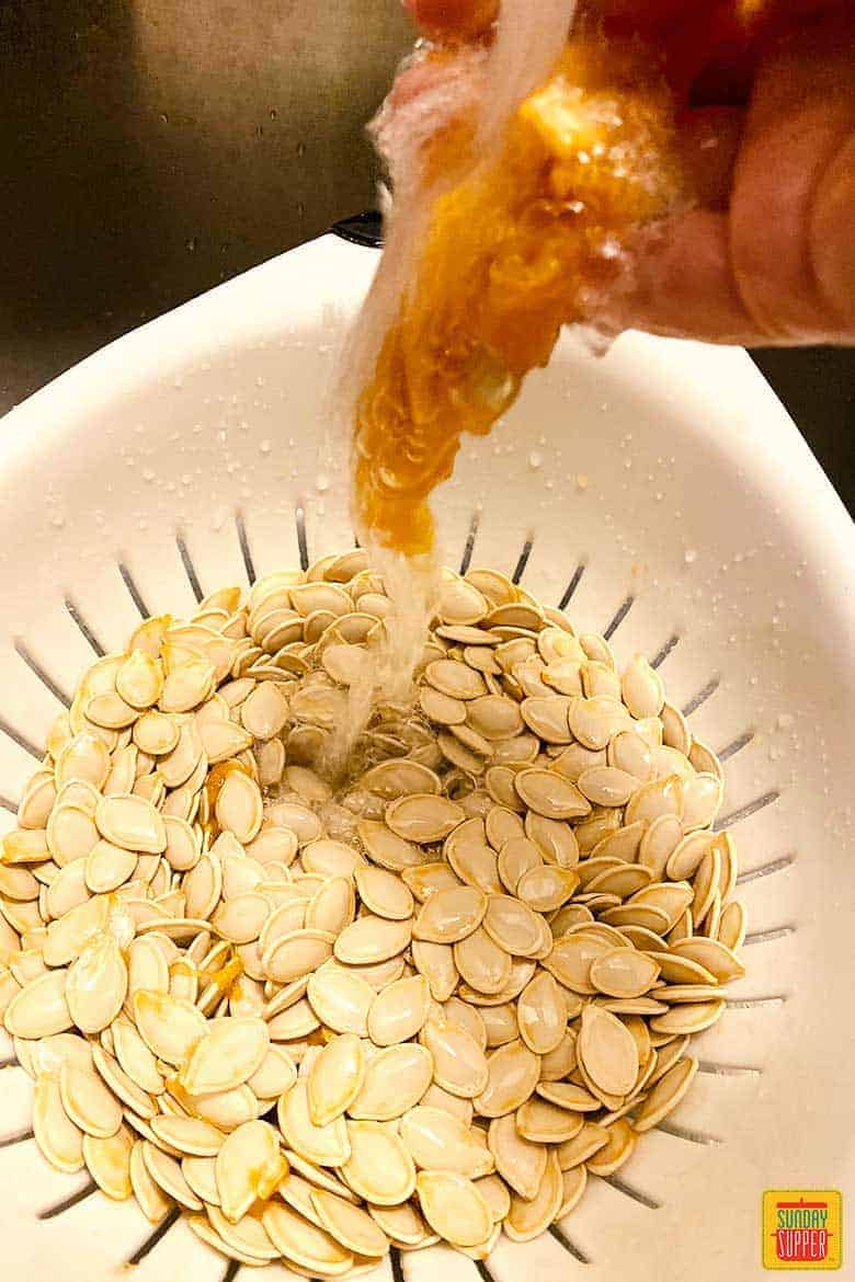 Pumpkin seeds in sink while cleaning