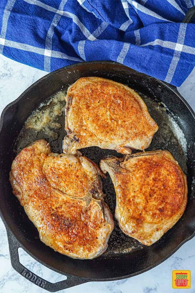 Pork chops browned in the pan
