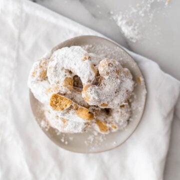 greek wedding cookies on a white dish