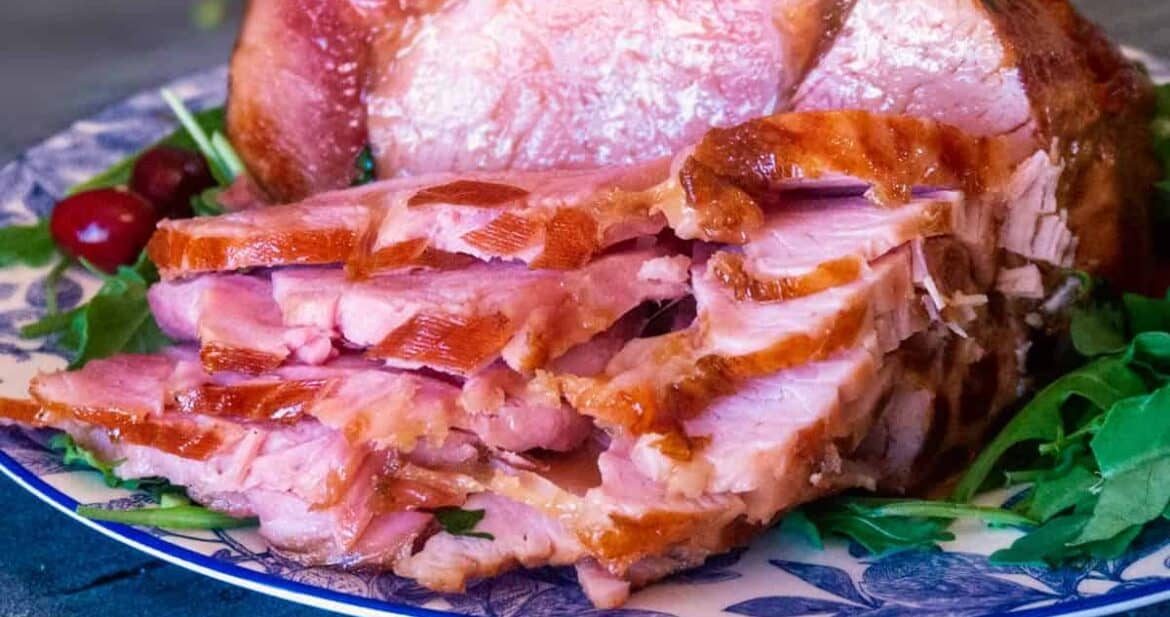 Sliced honey glazed ham on a platter