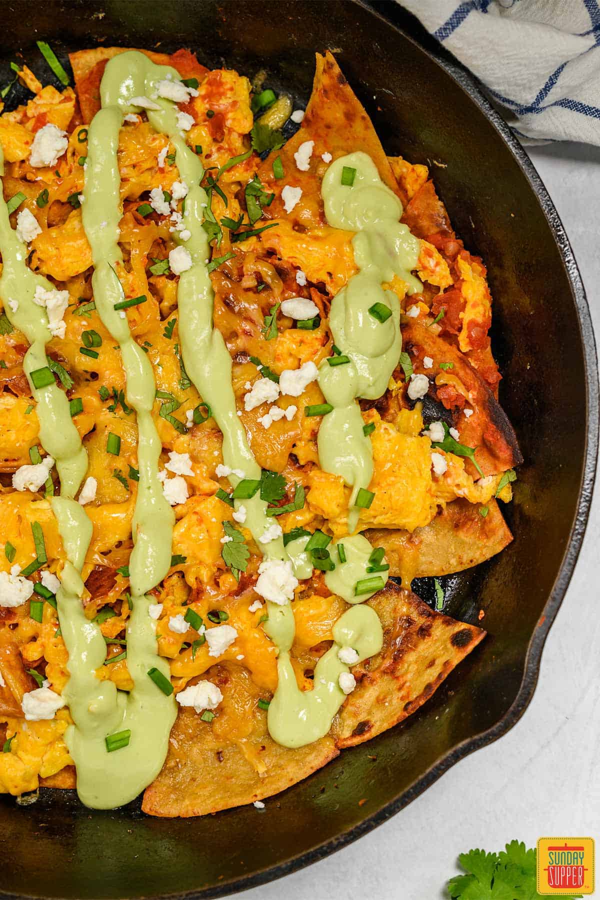 Close up of chilaquiles rojos in a cast iron skillet