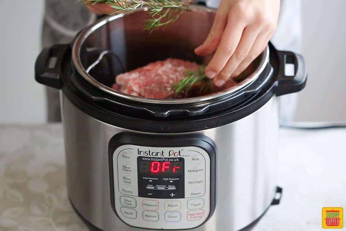 adding herbs into the instant pot