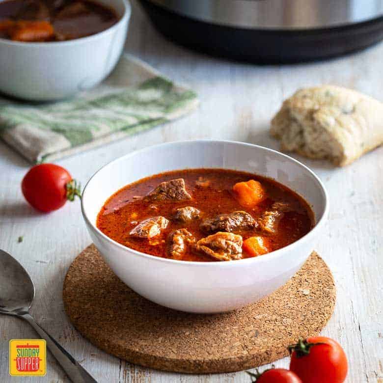 Instant pot beef stew in a white bowl