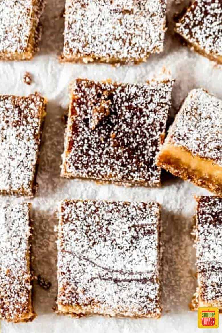 Milk bar pie squares in a row on parchment paper