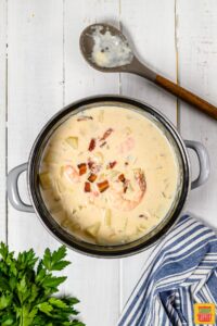Cooking seafood chowder in a soup pot