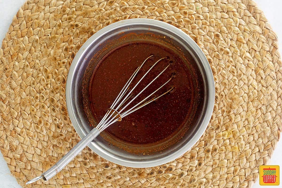 sauce for pulled pork in a small bowl