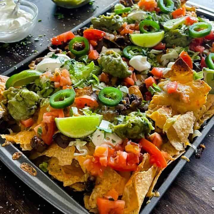 Steak nachos on a sheet pan ready to enjoy
