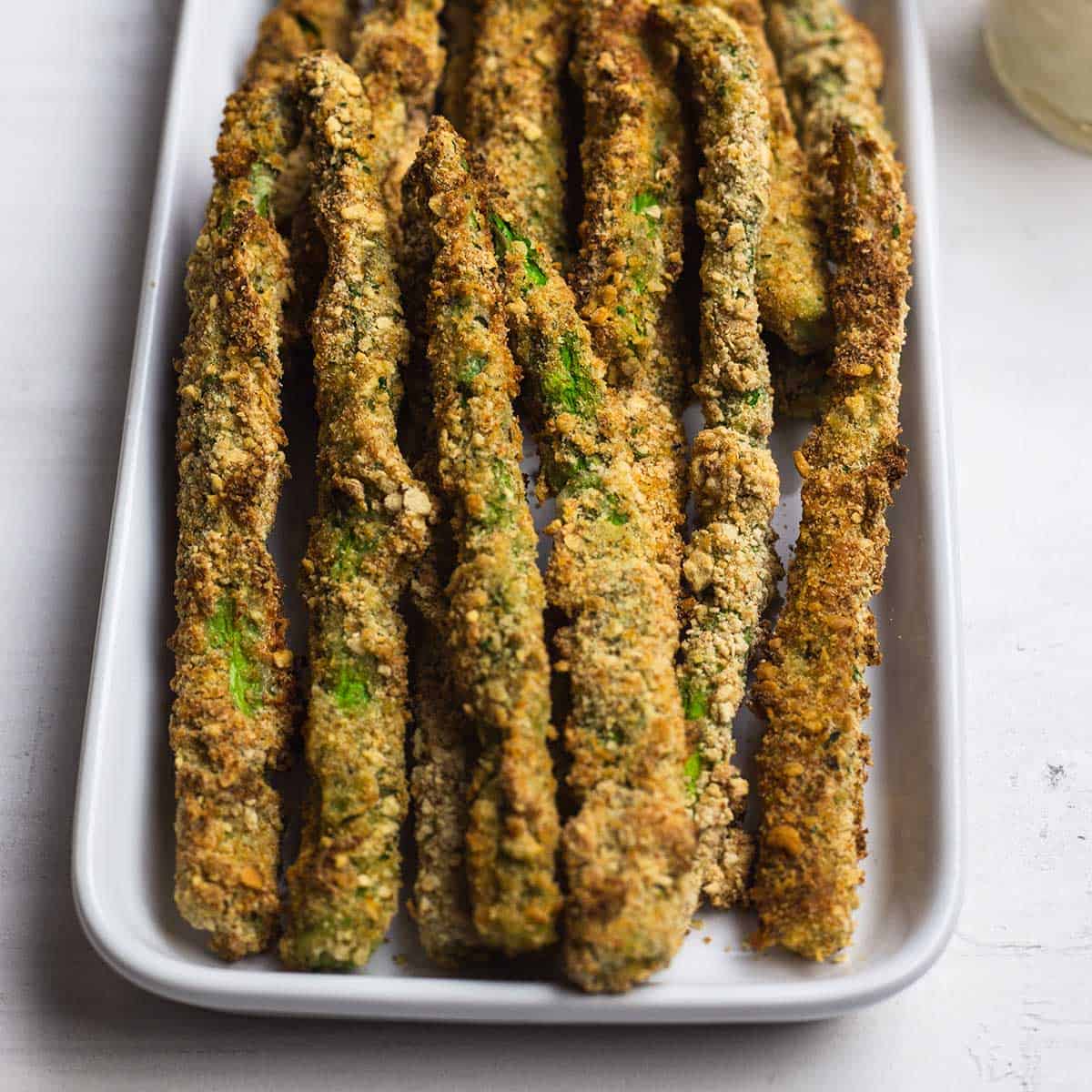 Air fryer asparagus on a white platter