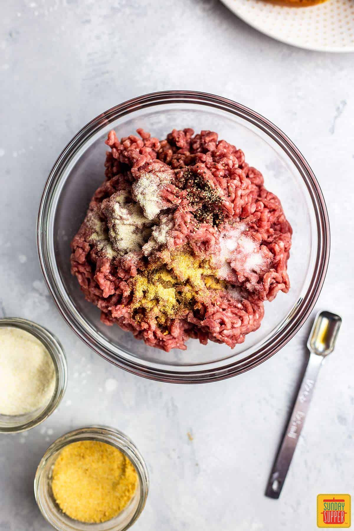 Mixing the ground beef mixture to make an air fryer burger