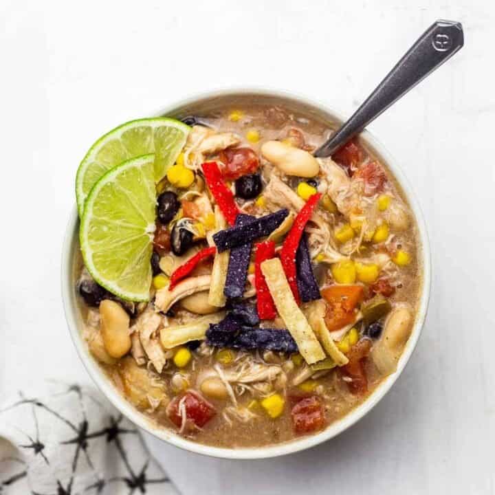 A single bowl of chick-fil-a chicken tortilla soup with a spoon