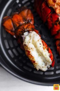 Fried lobster tails fresh out of air fryer for surf and turf recipe