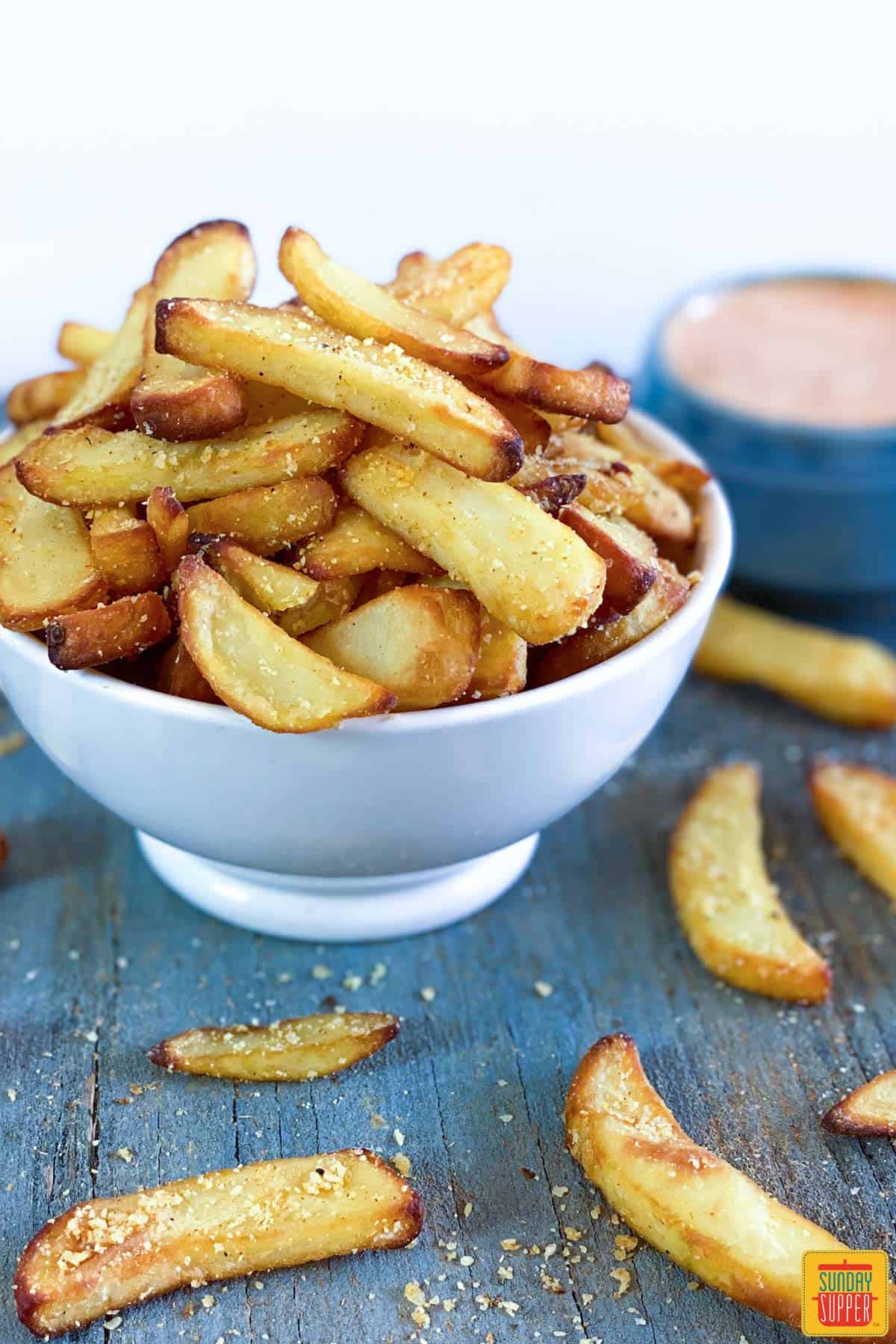 Close up of air fryer fries in a white bowl