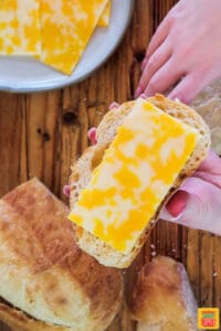 Adding cheese to grilled cheese sandwich