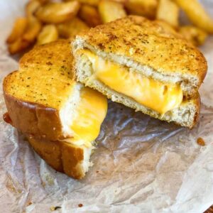 Two halves of air fryer grilled cheese