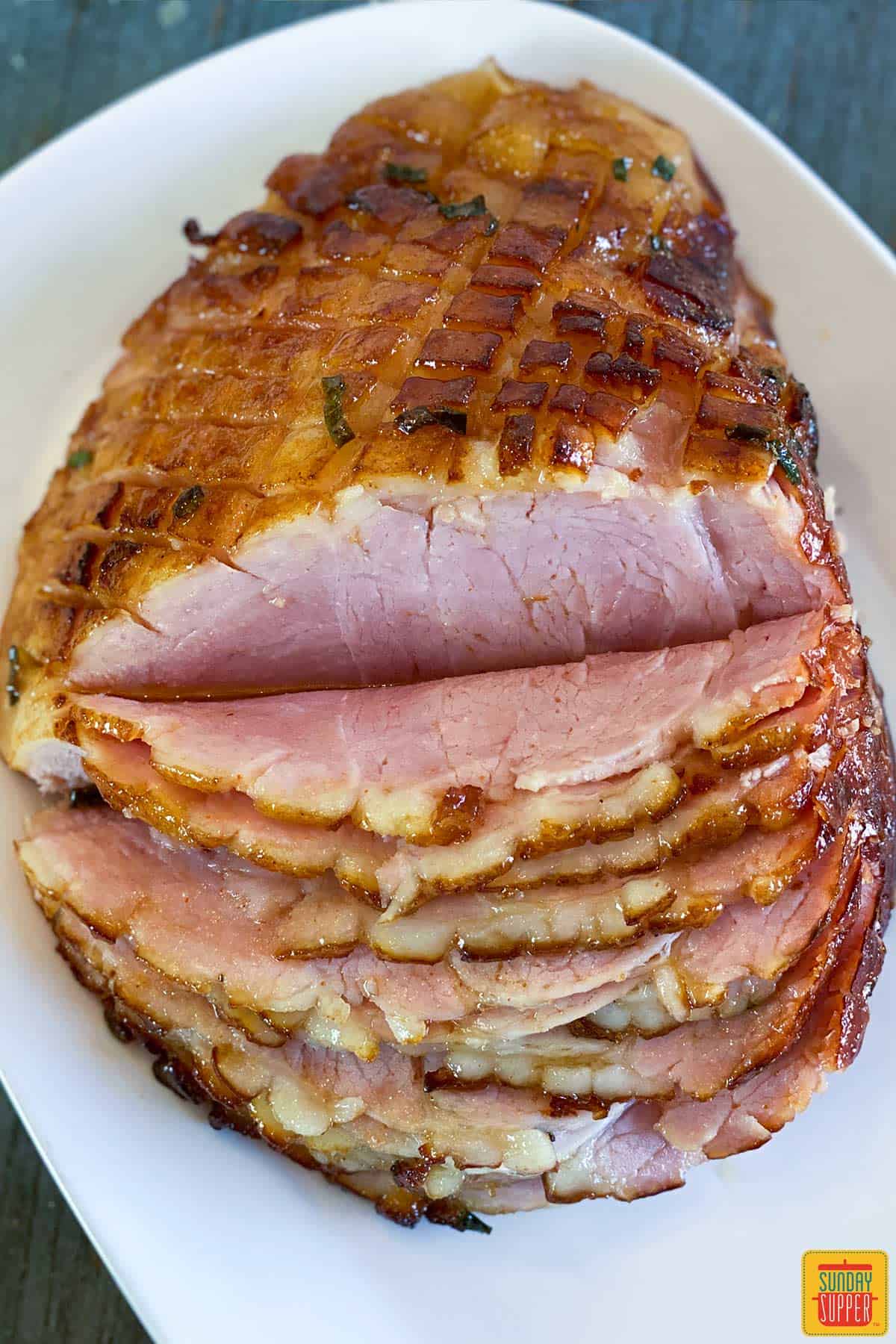 Air fryer ham with honey ham glaze on a platter