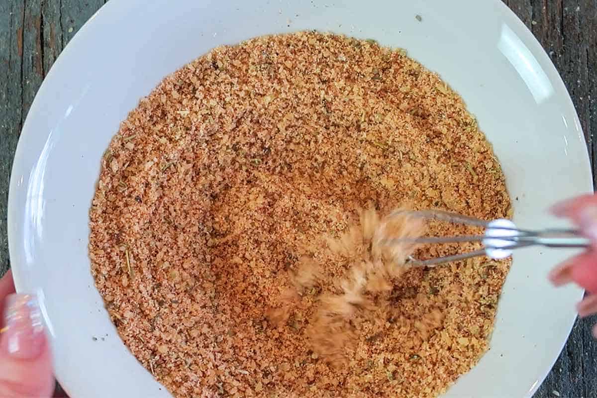 Mixing fry seasoning with a metal whisk