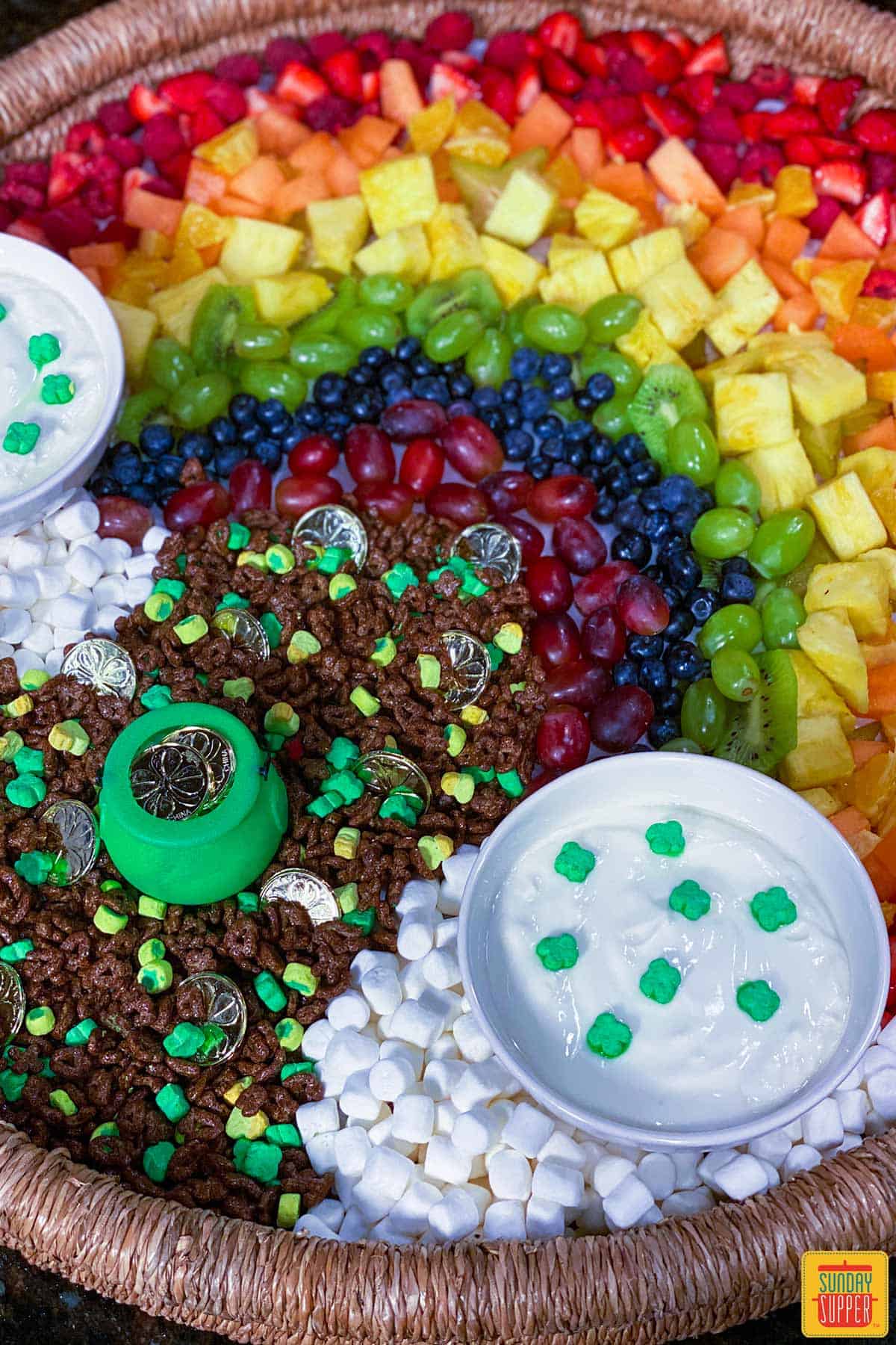 Fruit and yogurt parfait bar with little green pot of lucky charms