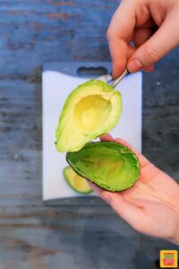 How to cut an avocado - Slices of avocado on a spoon
