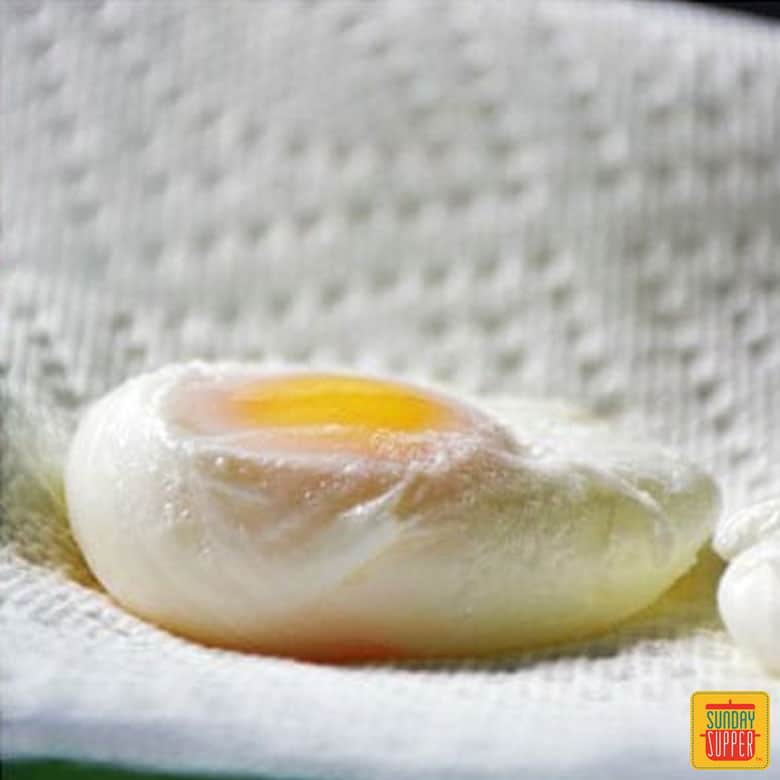 A poached egg on a paper towel