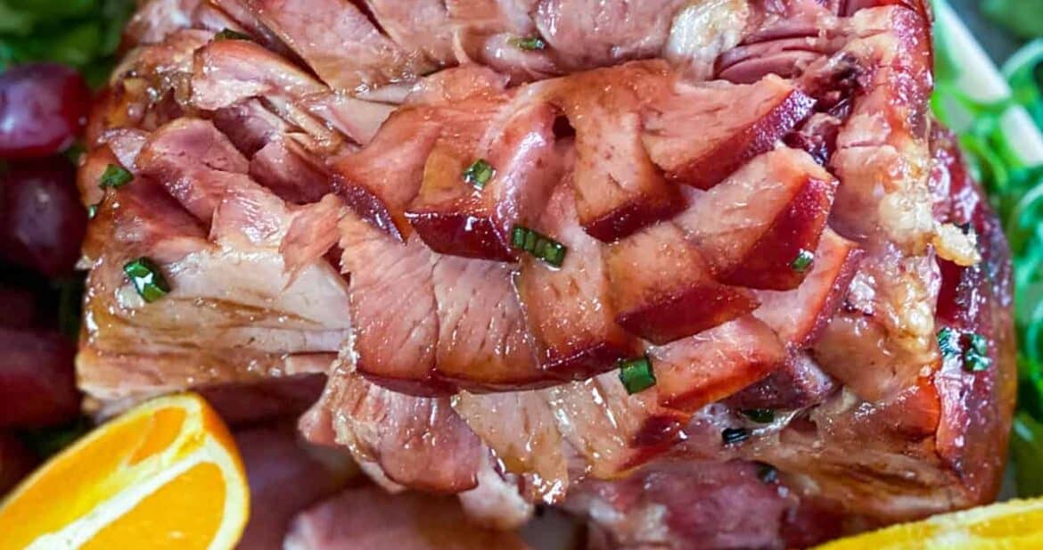 Close up of Instant Pot Ham with two orange wedges