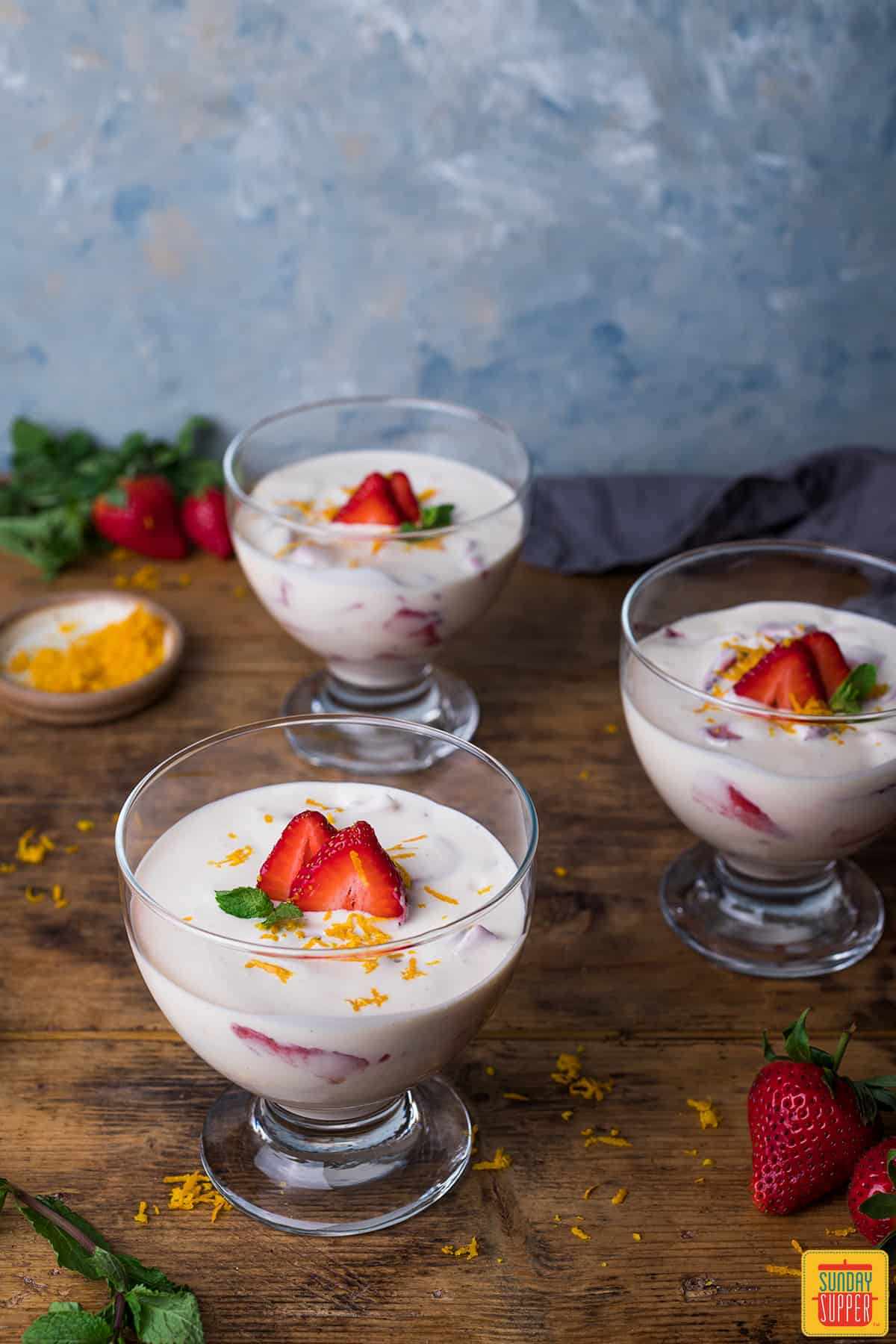 Three bowls of Mexican strawberries and cream