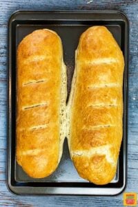 After baking homemade french bread recipe - two loaves on a baking sheet