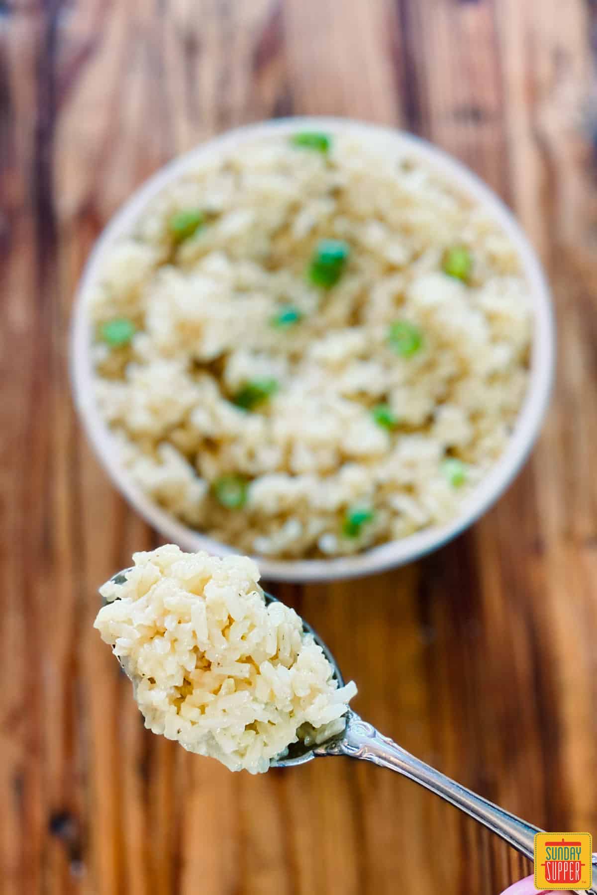 Taking a spoonful of sticky white rice