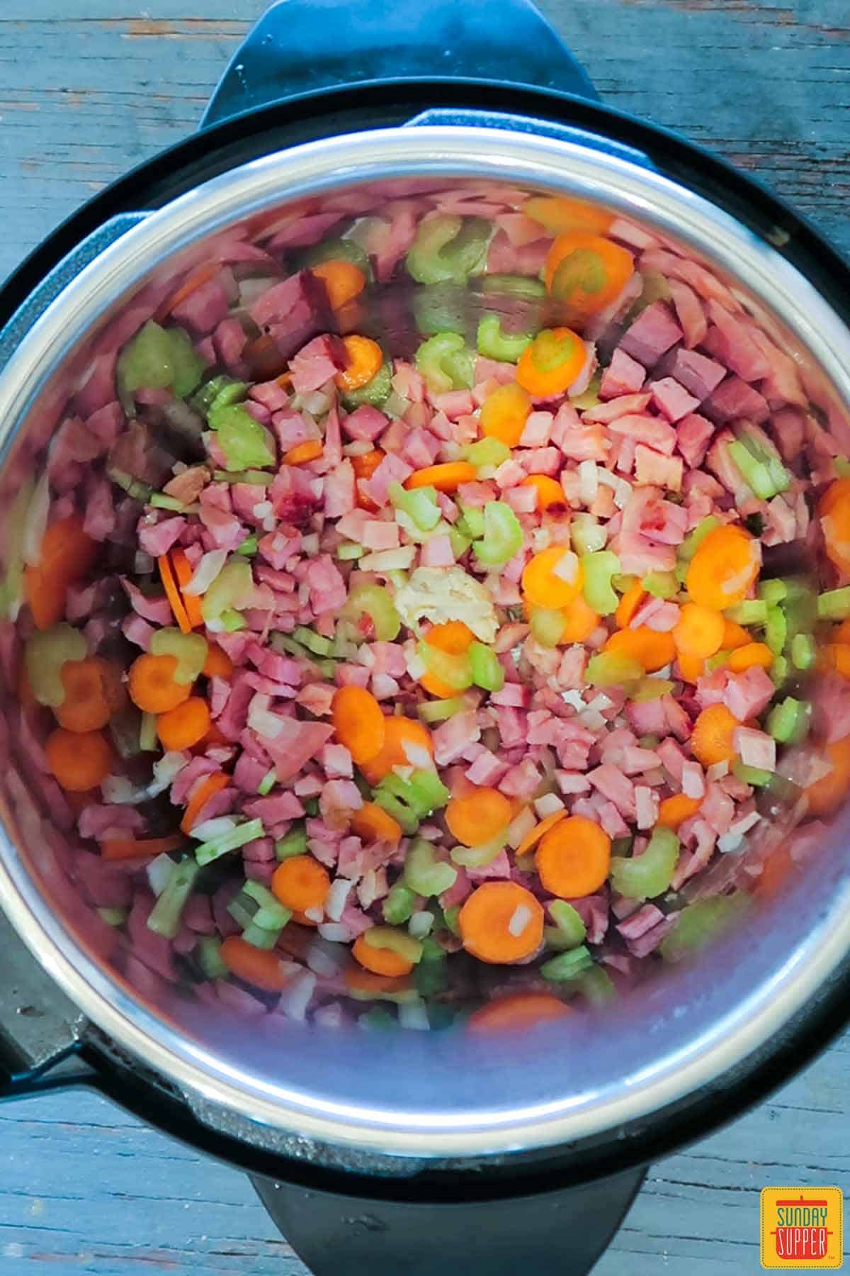 Cooking ham with celery and carrots for ham soup recipe