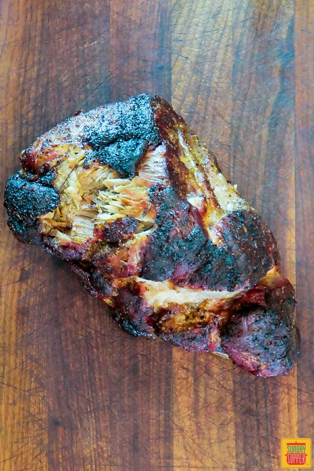Grilled pork butt recipe on cutting board