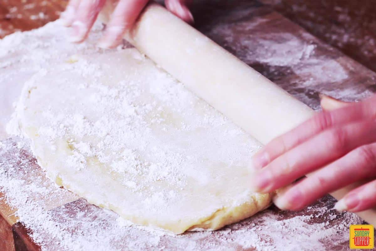 Rolling out the dough for Portuguese shrimp empanadas