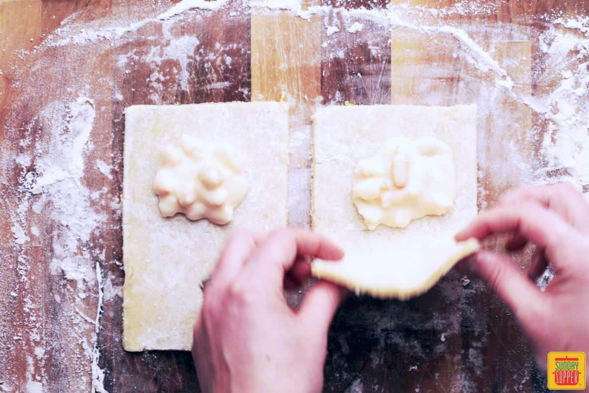 Folding over the dough for Shrimp empanadas