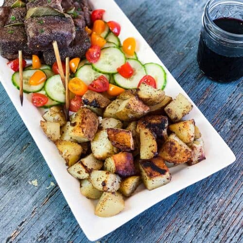 Grilled Potatoes Recipe served on a white platter