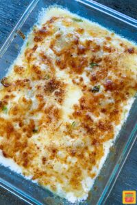 A glass baking dish of instant pot scalloped potatoes