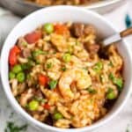 Close up of shrimp and beef easy paella recipe in a white bowl