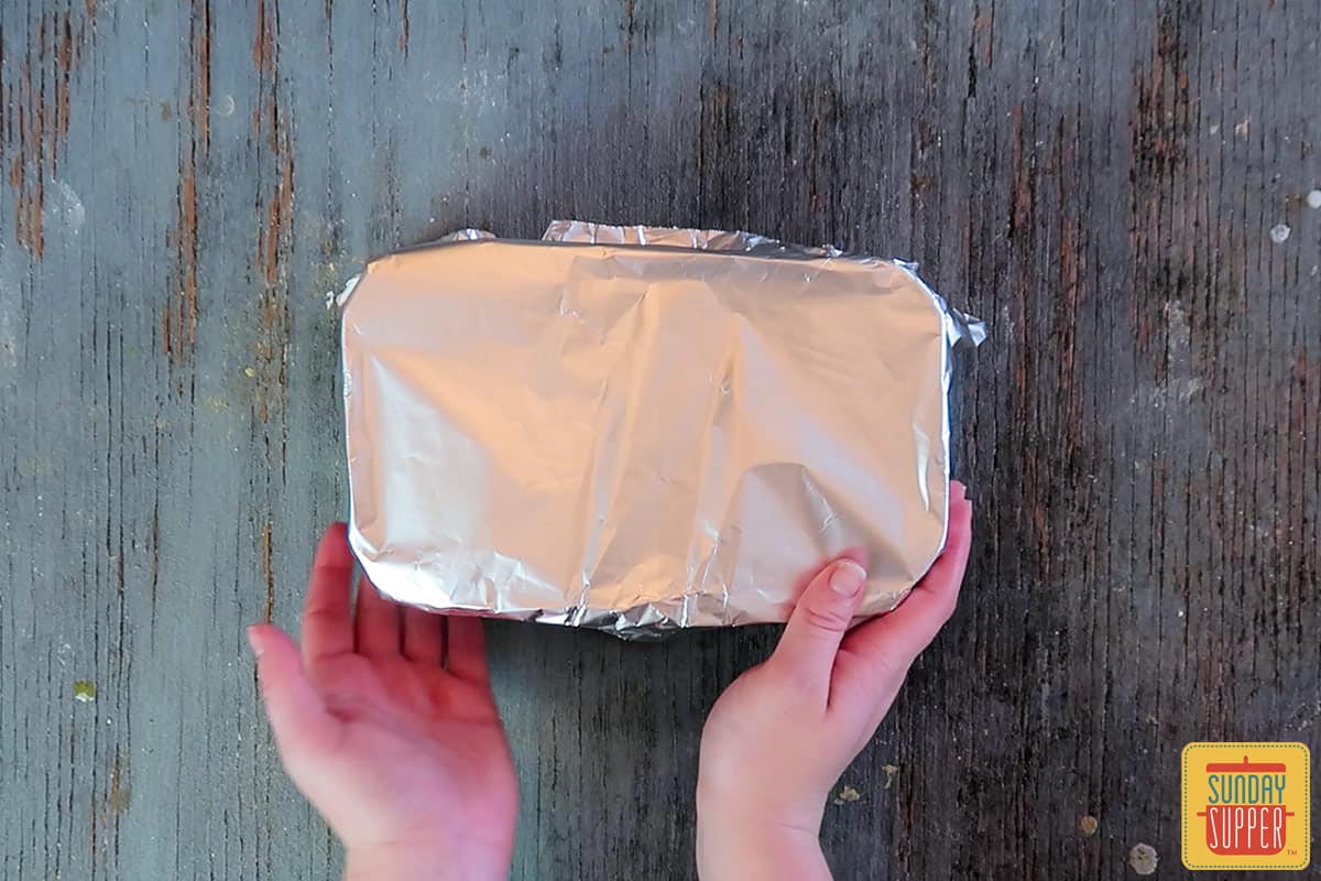 Wrapping the loaf pan in tin foil