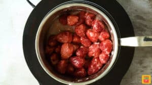 cooking strawberries in a sauce pan