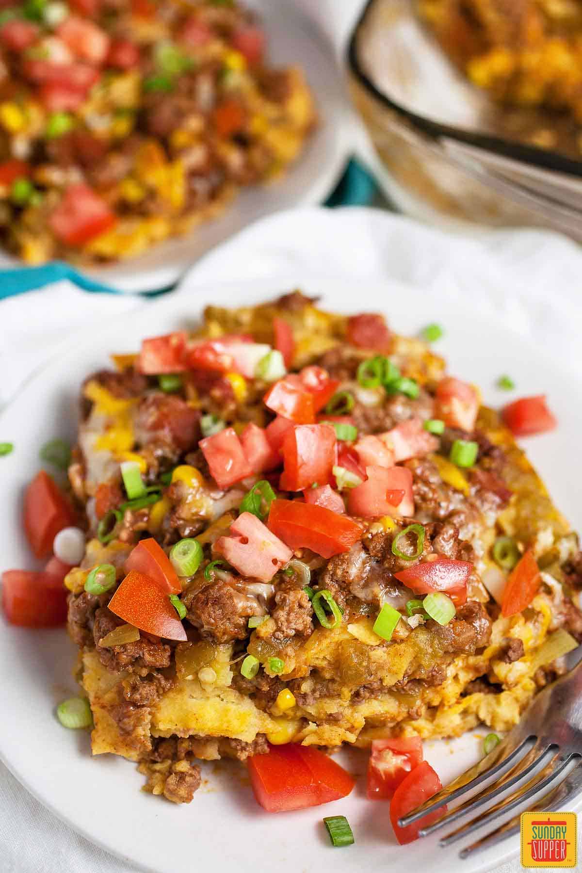 A white plate of taco lasagna