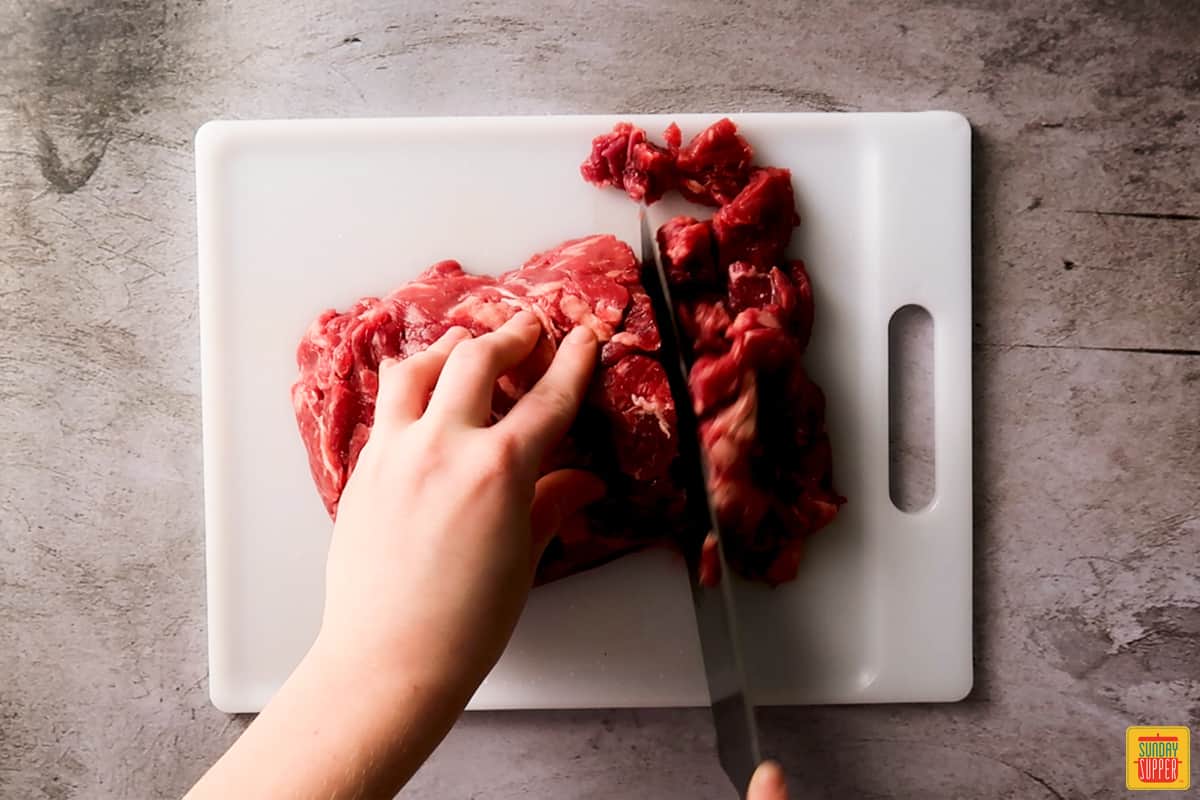 Cutting bottom round roast into cubes