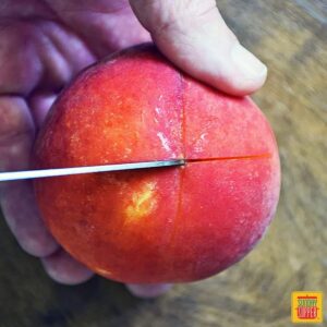 Scoring a peach with an "X" pattern