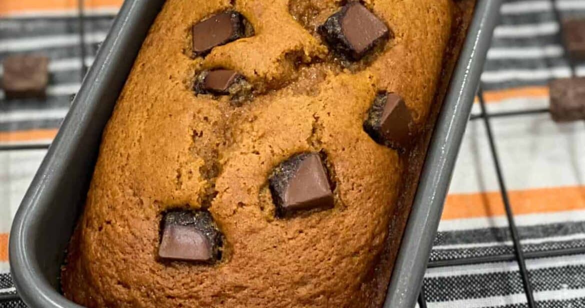 A close up loaf pan with chocolate chip pumpkin bread