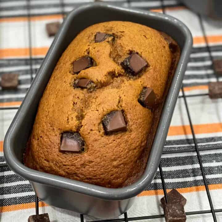A close up loaf pan with chocolate chip pumpkin bread