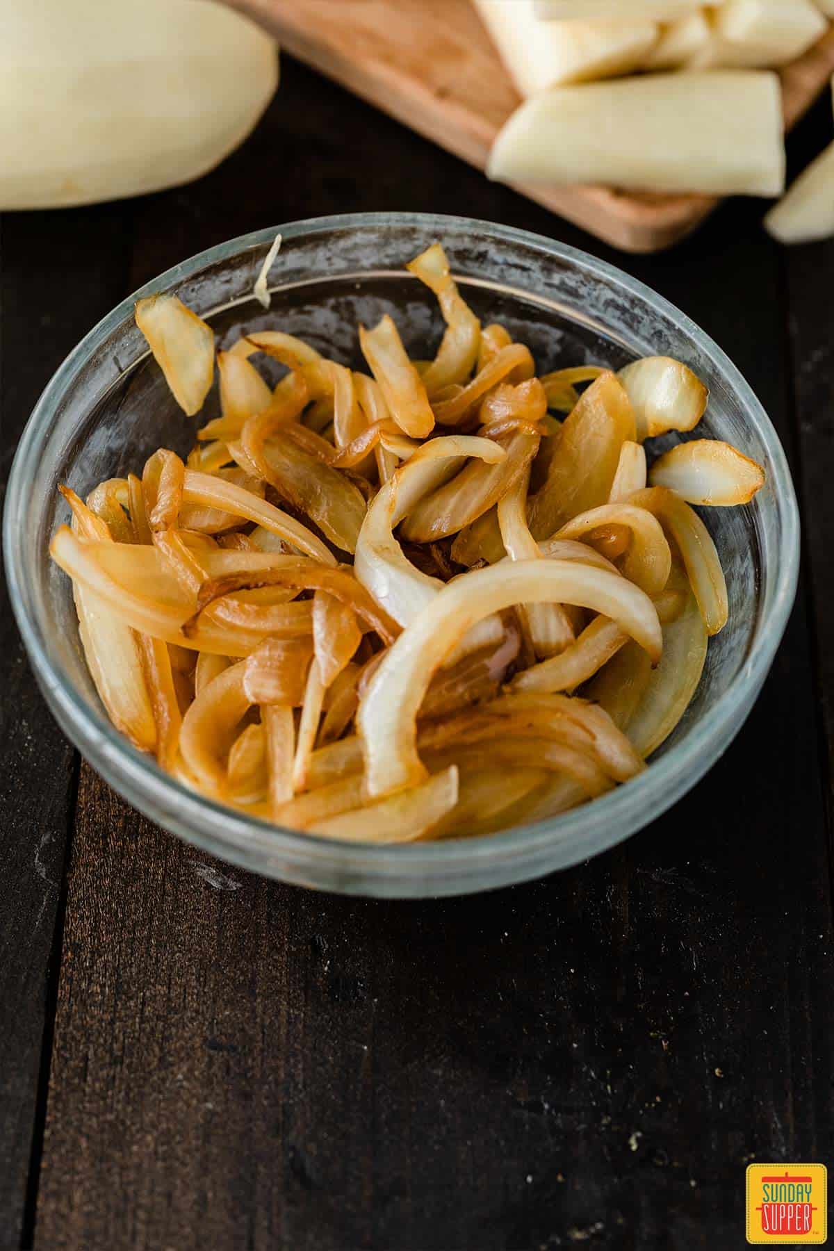 Sauteed onions in a glass bowl