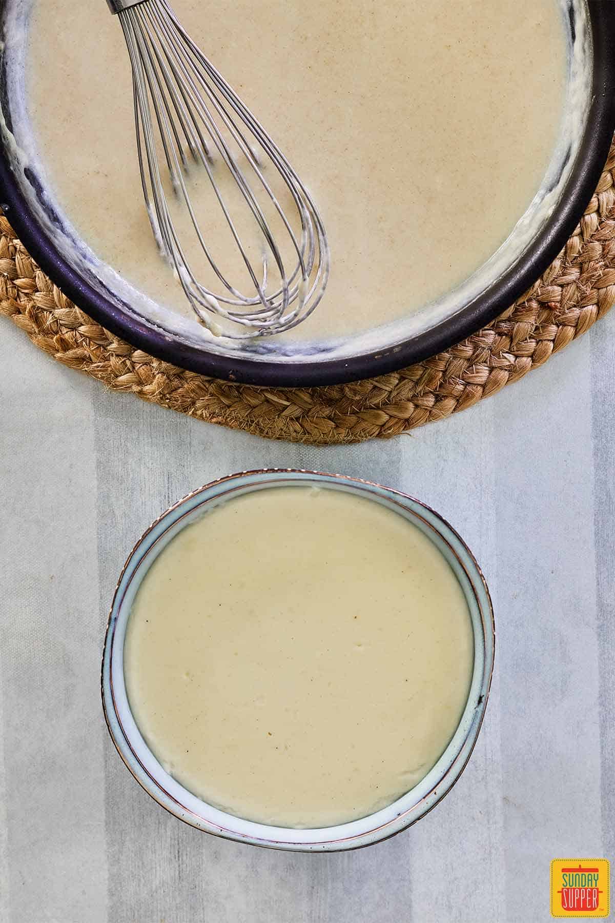 bechamel sauce in a pan and bowl
