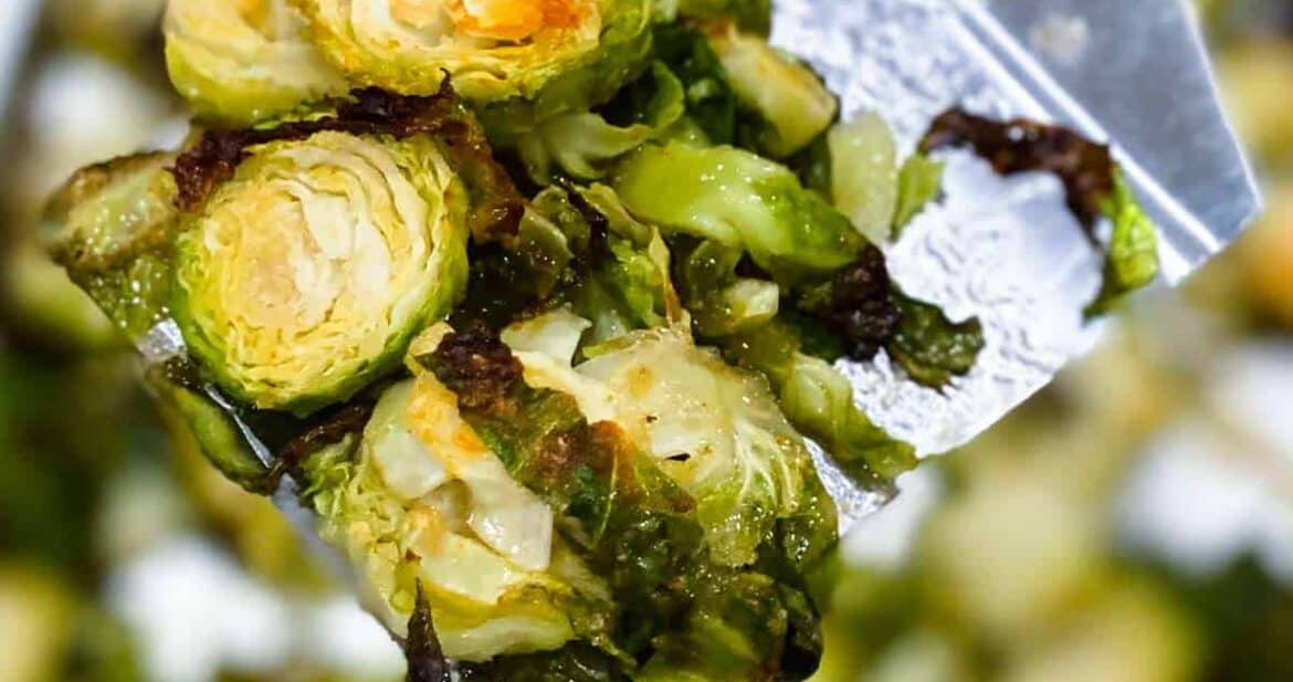 Roasted brussels sprouts on a metal spatula