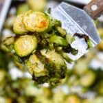 Roasted brussels sprouts on a metal spatula